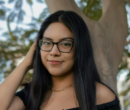 Woman with glasses near tree